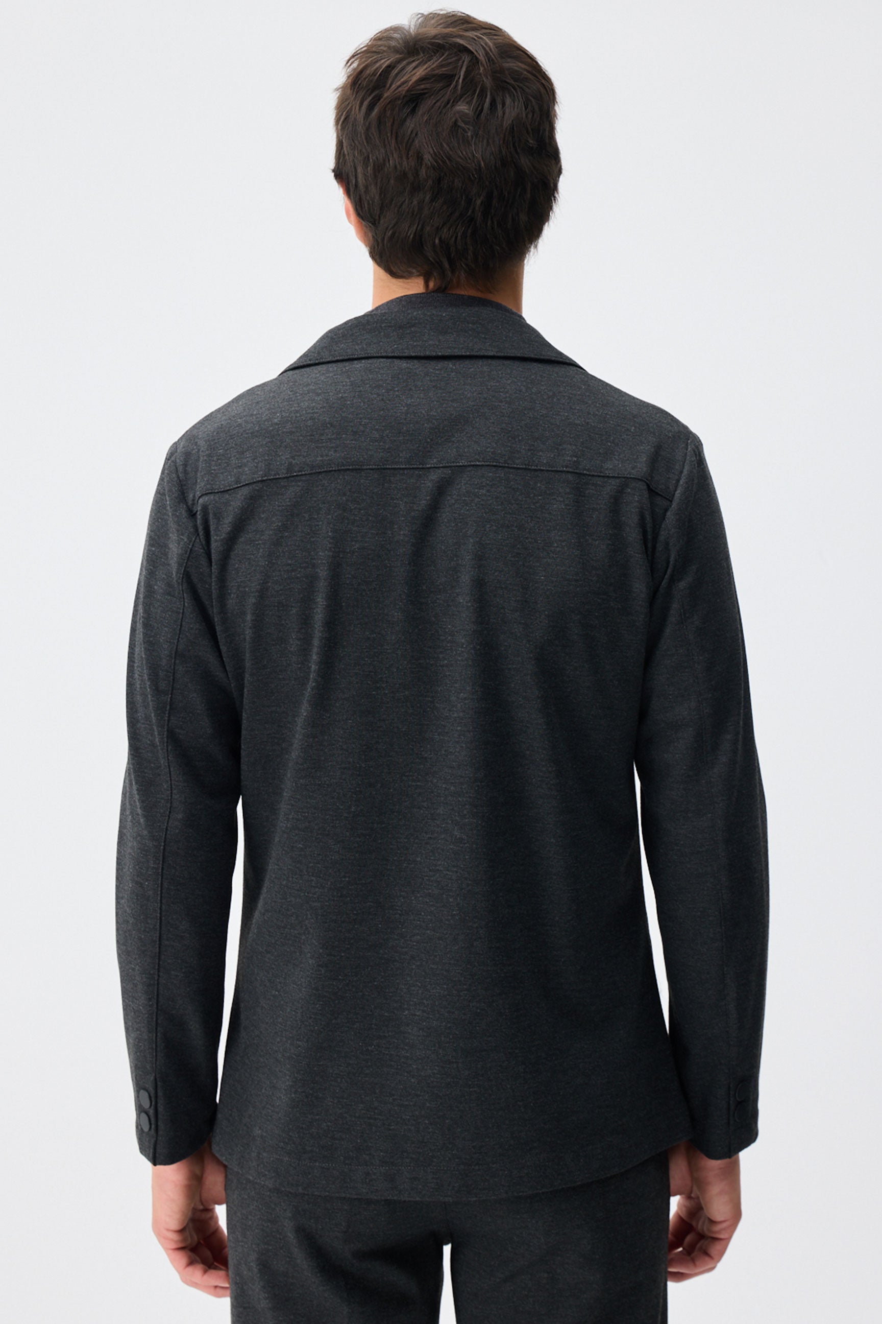 Herenpak bestaande uit een blazer en een broek van zachte, antracietkleurige jersey in smart casual stijl.