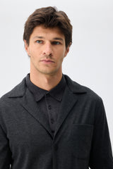 Herenpak bestaande uit een blazer en een broek van zachte, antracietkleurige jersey in smart casual stijl.