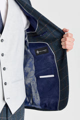 Harris marineblauwe tweedpak met contrasterend Belmont zilverkleurig vest.