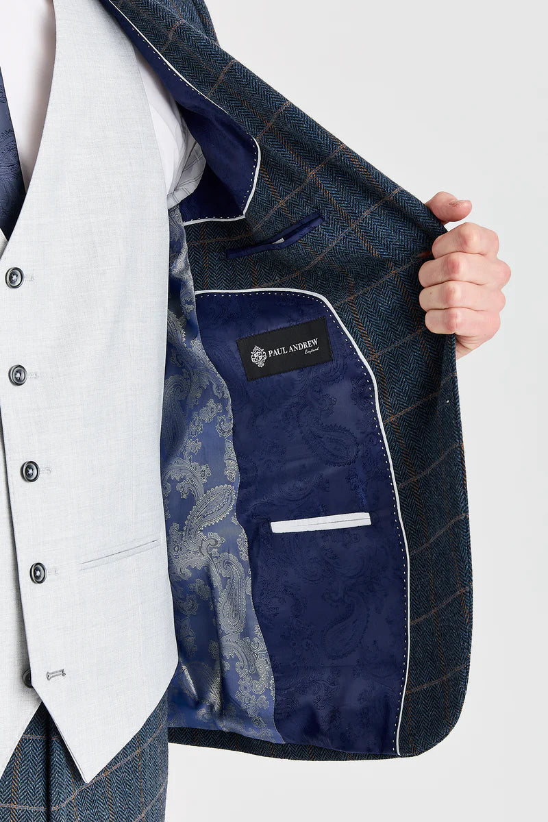 Harris marineblauwe tweedpak met contrasterend Belmont zilverkleurig vest.