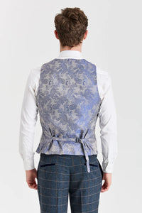 Harris marineblauwe tweedpak met contrasterend Belmont zilverkleurig vest.