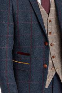 Madrid marineblauw pak met contrasterend Harris Brown tweed vest.