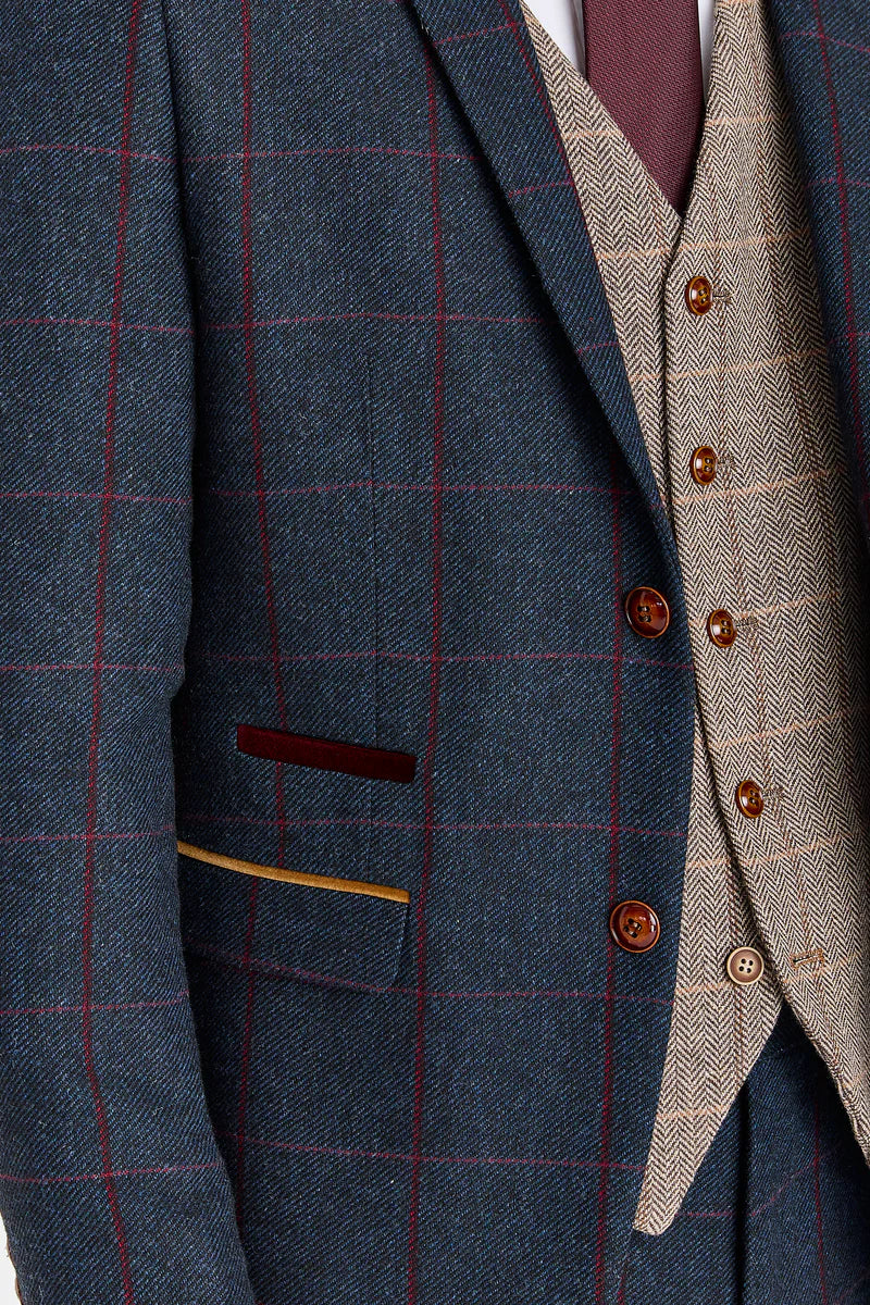 Madrid marineblauw pak met contrasterend Harris Brown tweed vest.