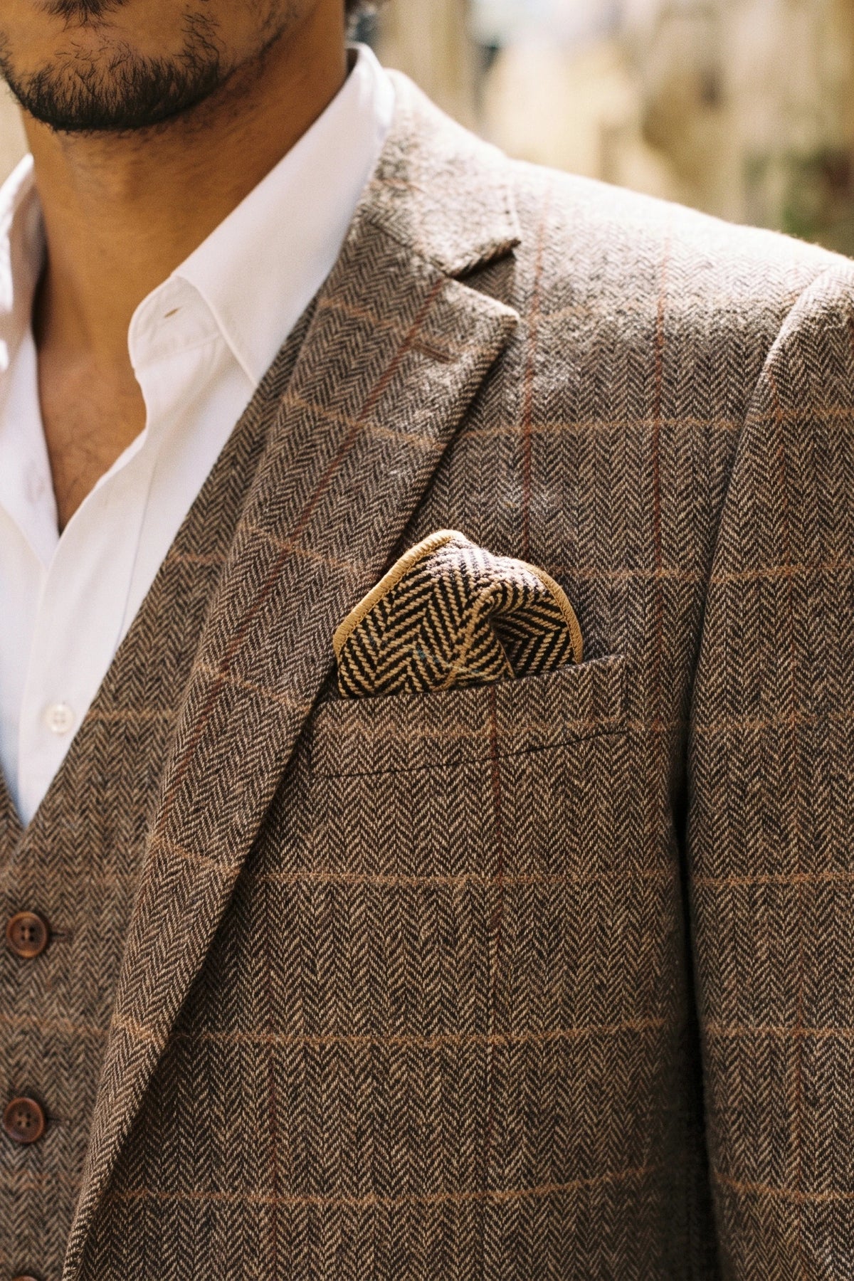 Gouden tweed pochet voor heren, gemaakt van een wollen mix.