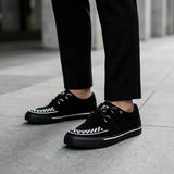 Puntige Creeper sneakers in zwart-wit suède met platformzool